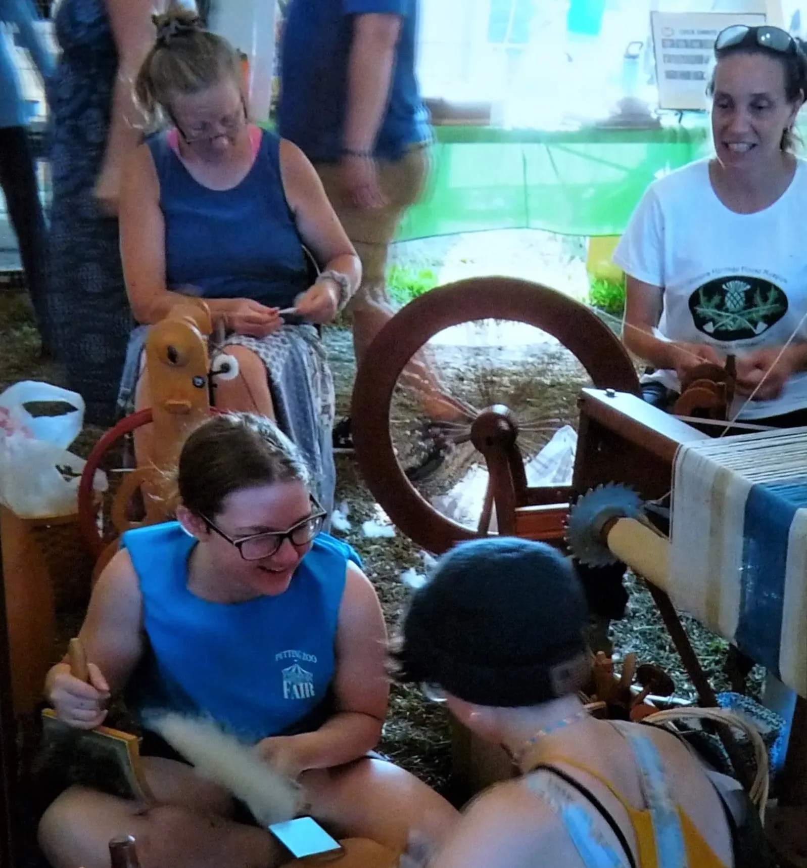 young people enjoying company with spinning wheel
