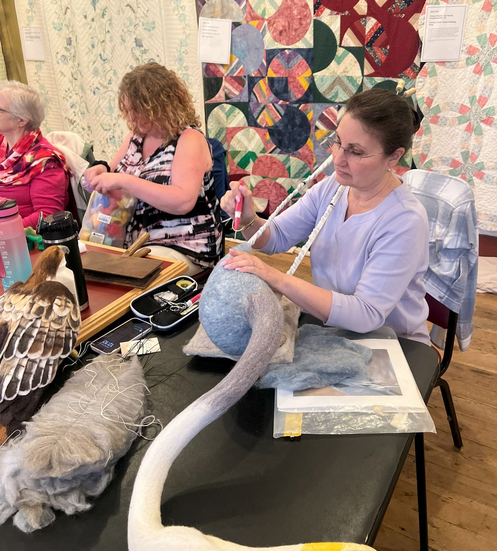 woman crafting an item using felting methods